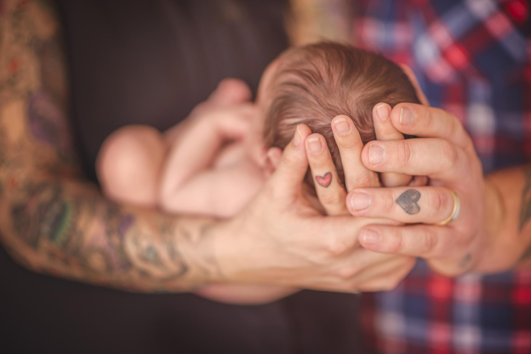Parents holding a young child
